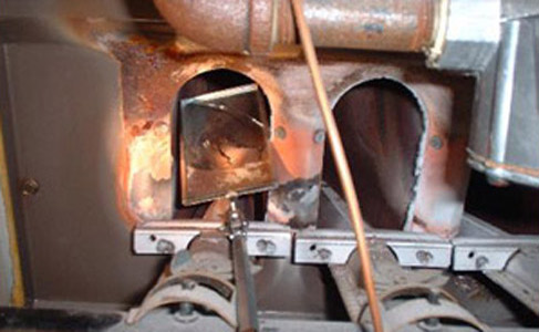 Cracked firebox on an old rusty furnace. Cracked heat exchanger on a furnace. We are furnace heat exchanger experts. Your furnace firebox is in good hands.